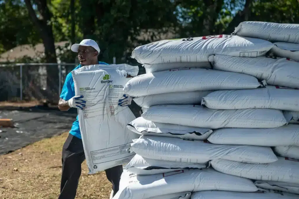 man moving mulch in detroit
